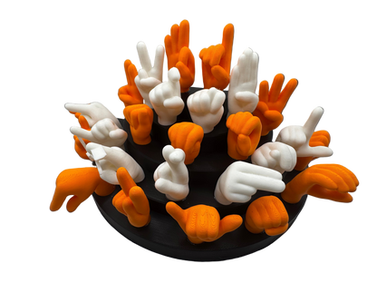 Set of orange and white hand gesture figures on a black base