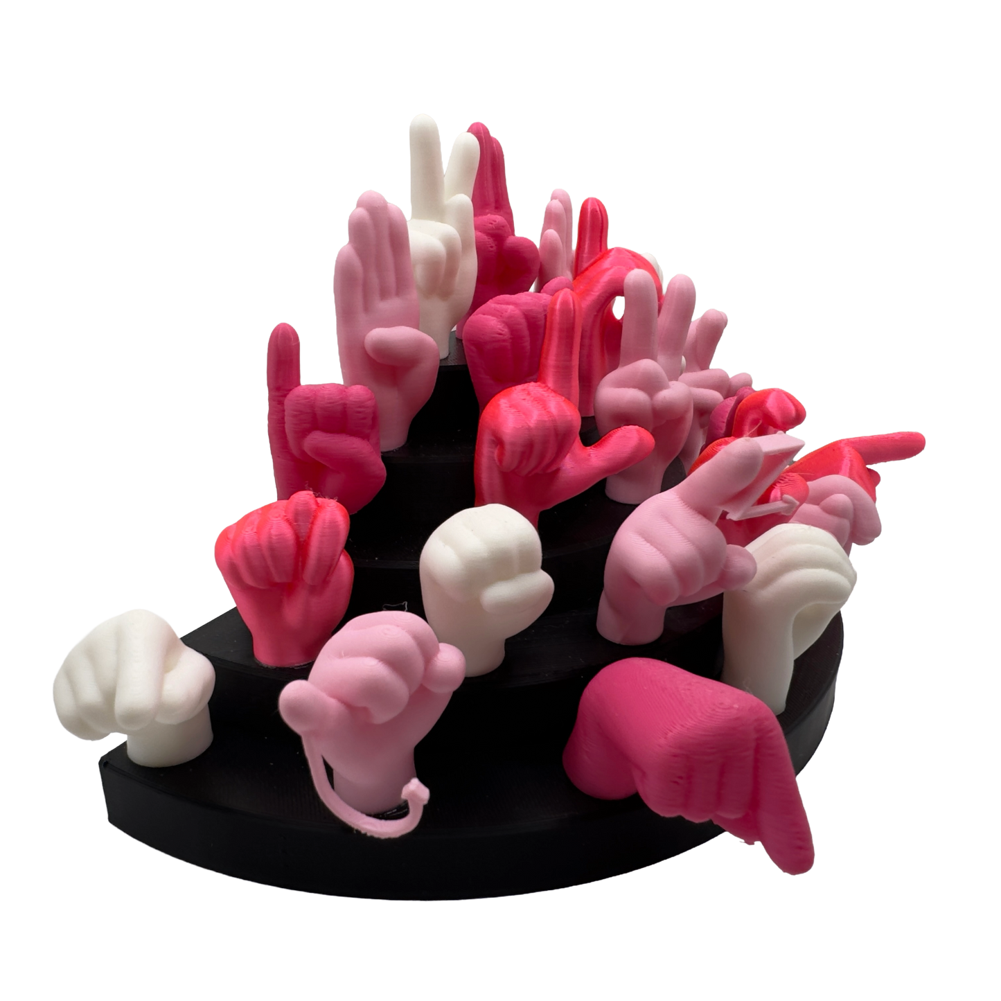 Set of pink, magnet and white hand gesture figures on a black base