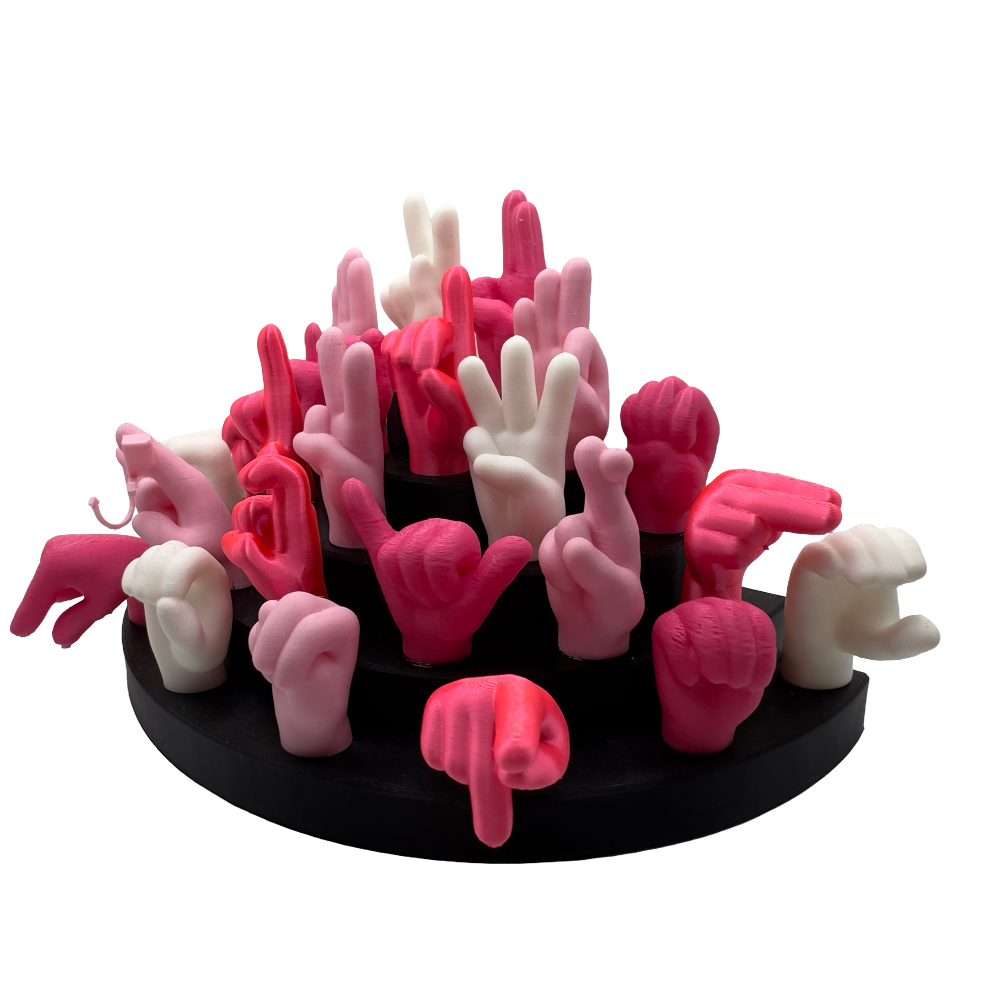 Set of pink, magnet and white hand gesture figures on a black base