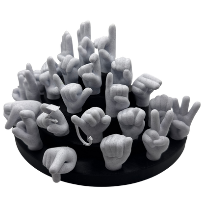 Black base with marble hand-shaped objects on a white background