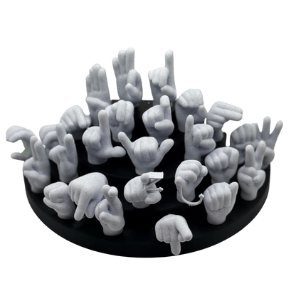 Black base with marble hand-shaped objects on a white background