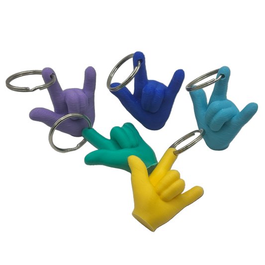 Five colorful ASL ILY keychains on a white background