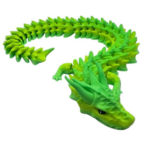 Green/Yellow dragon toy figure on a white background
